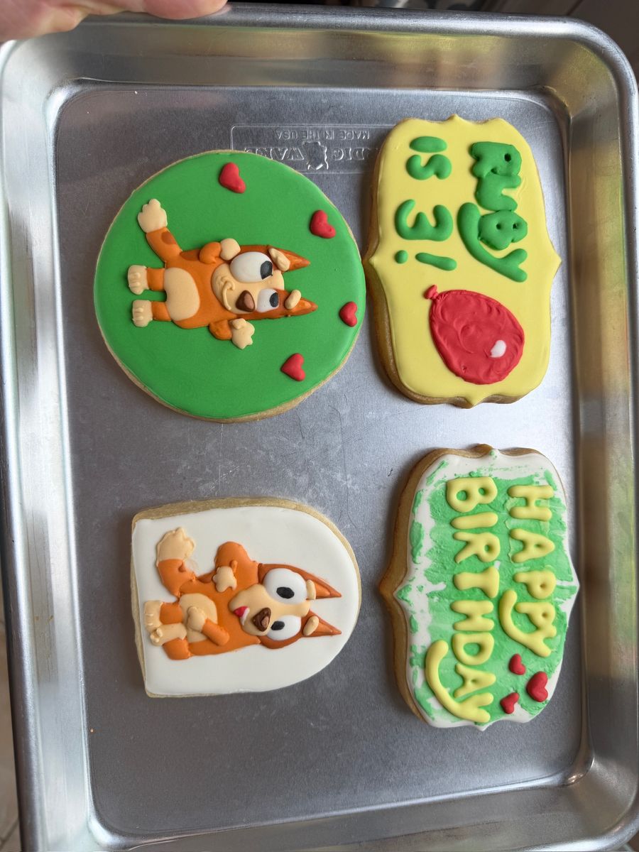 Custom decorated cartoon puppy third birthday cookies