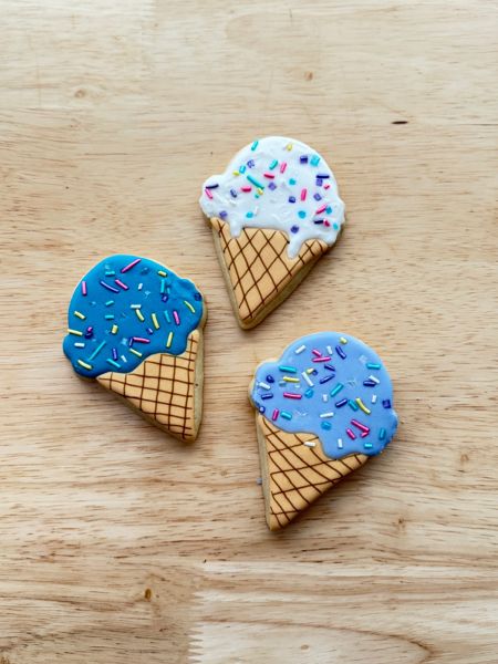 Decorated sugar cookies shaped like ice cream cones