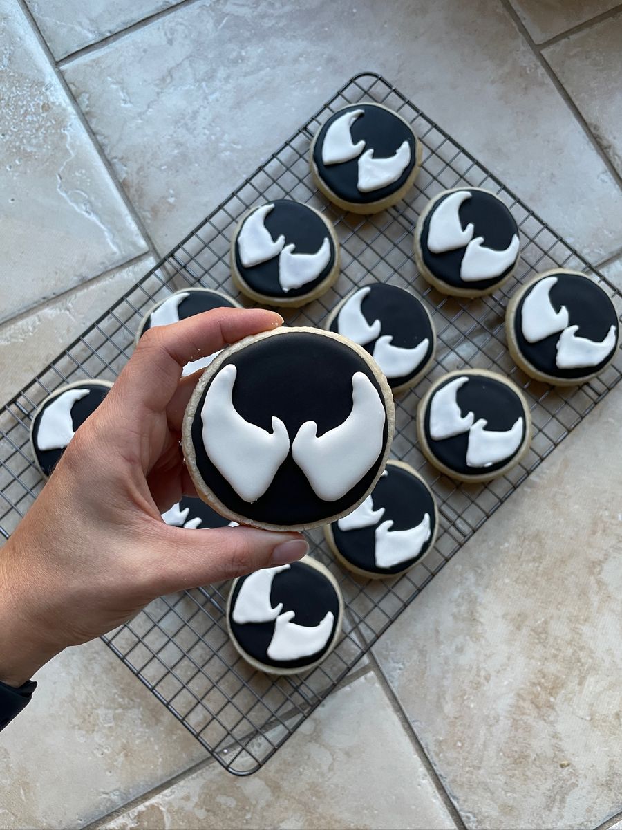 Black and white superhero themed decorated cookies